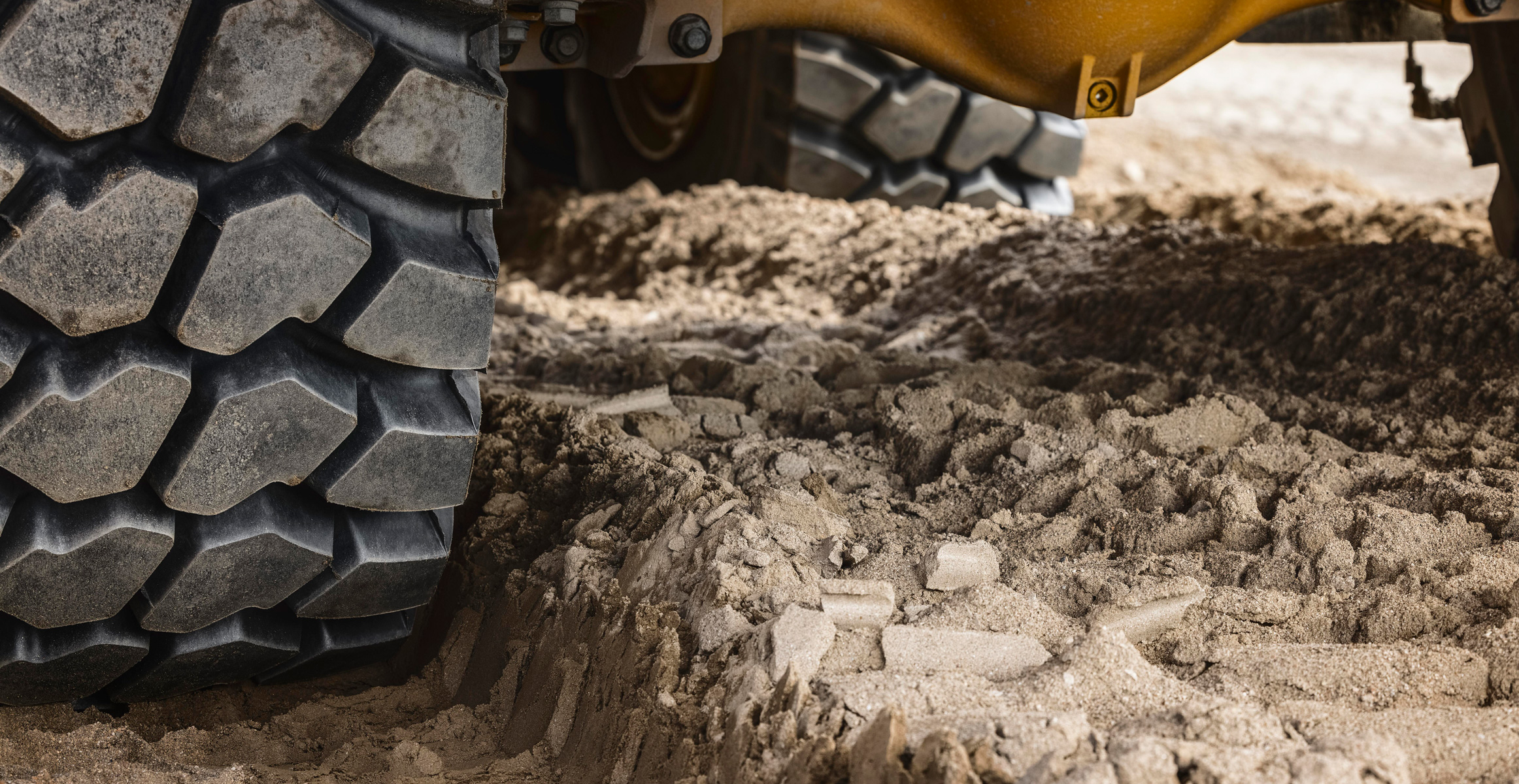 Close-up of the tires on a Volvo articulated haul truck.