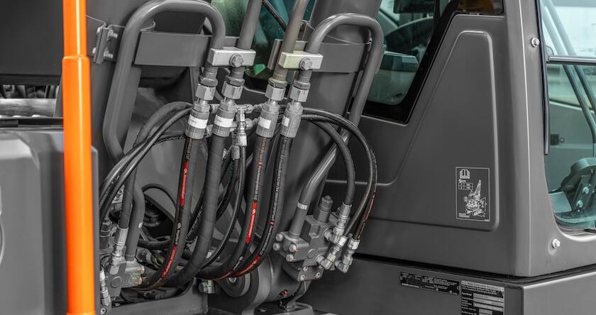 Close-up of the hoses behind the cab of a Volvo excavator