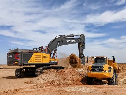 Volvo crawler excavator loading an articulated truck