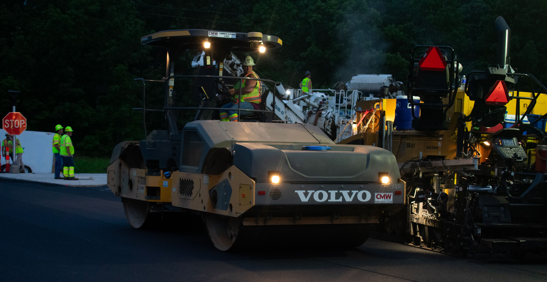 Volvo DD120C double drum roller at night with West Contracting in St. Louis, Missouri