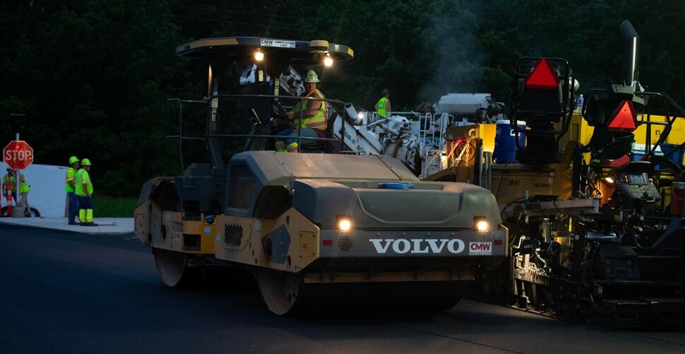 Volvo DD120C double drum roller at night with West Contracting in St. Louis, Missouri