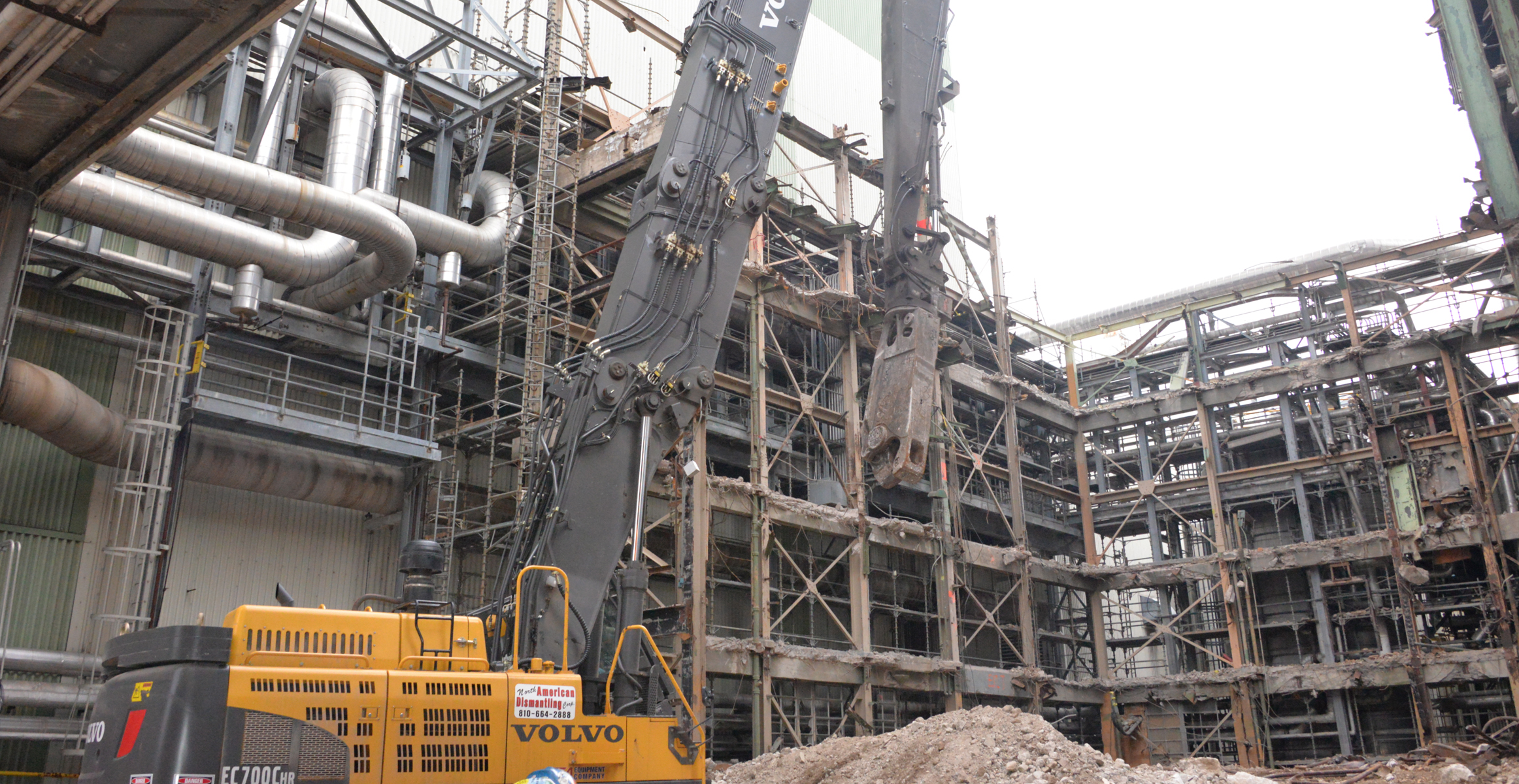 North American Dismantling Corp. demolishes a boiler with the help of a Volvo EC700C high-reach excavator. 