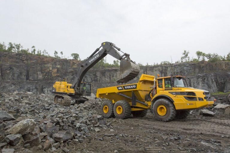 A Volvo excavator loads an A40G articulated truck for Barton