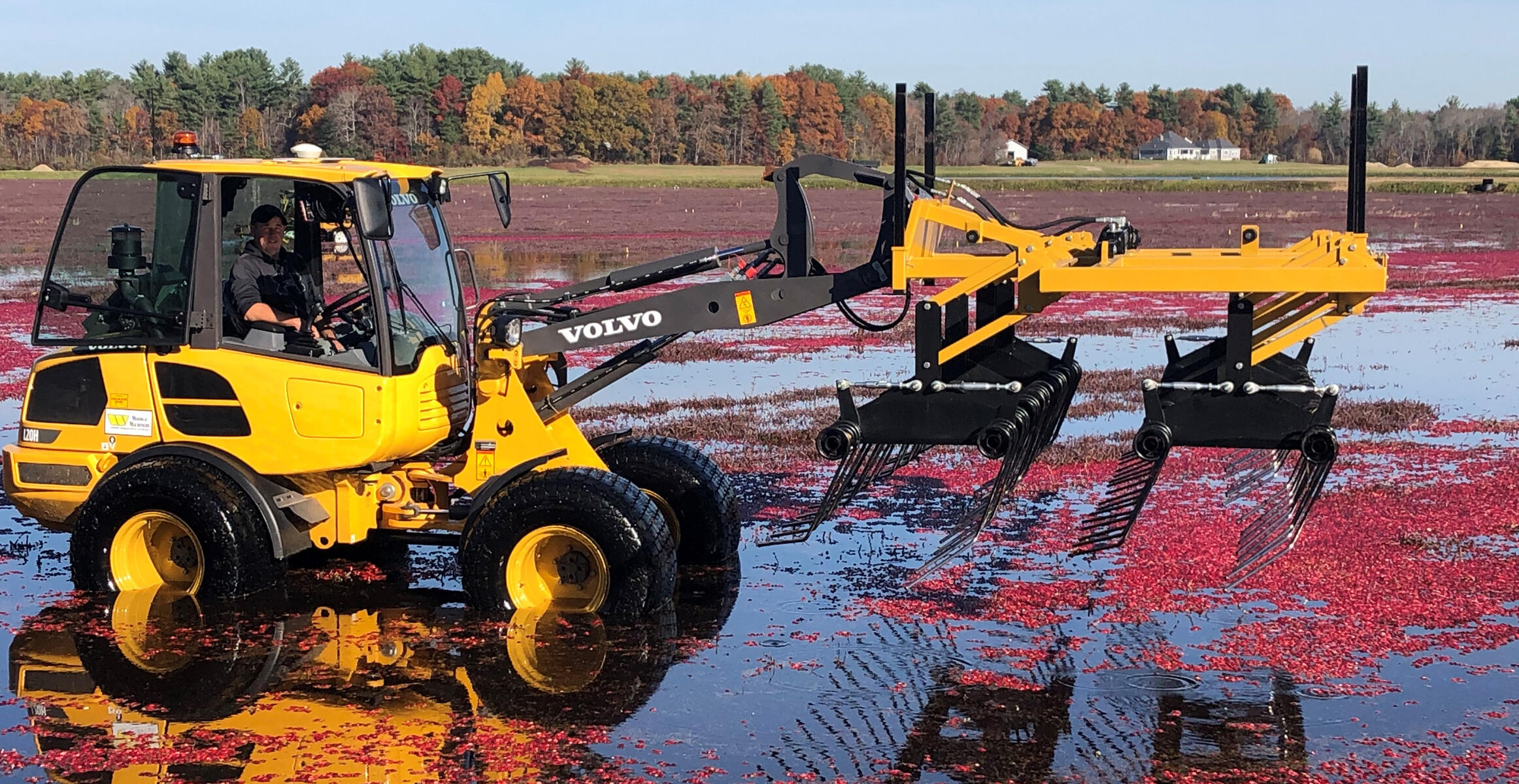 Derek Harju with Ken Harju & Sons Cranberries Inc. and a Volvo compact wheel loader