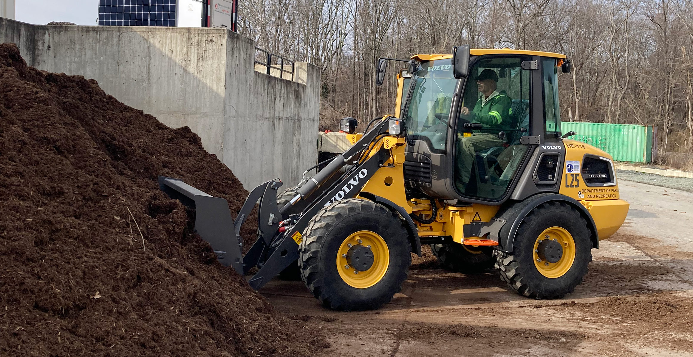 A worker from the Prince George’s County Parks and Recreation Department moves material with a Volvo electric wheel loader.
