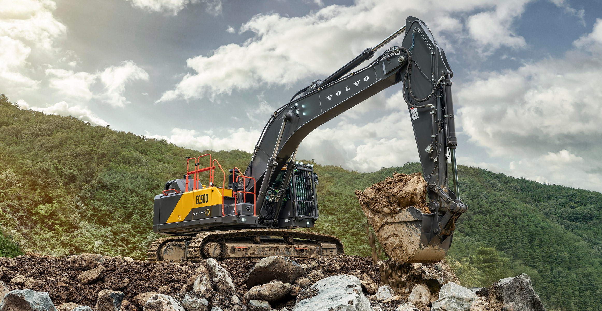 A Volvo EC500 crawler excavator loading rock in a quarry.