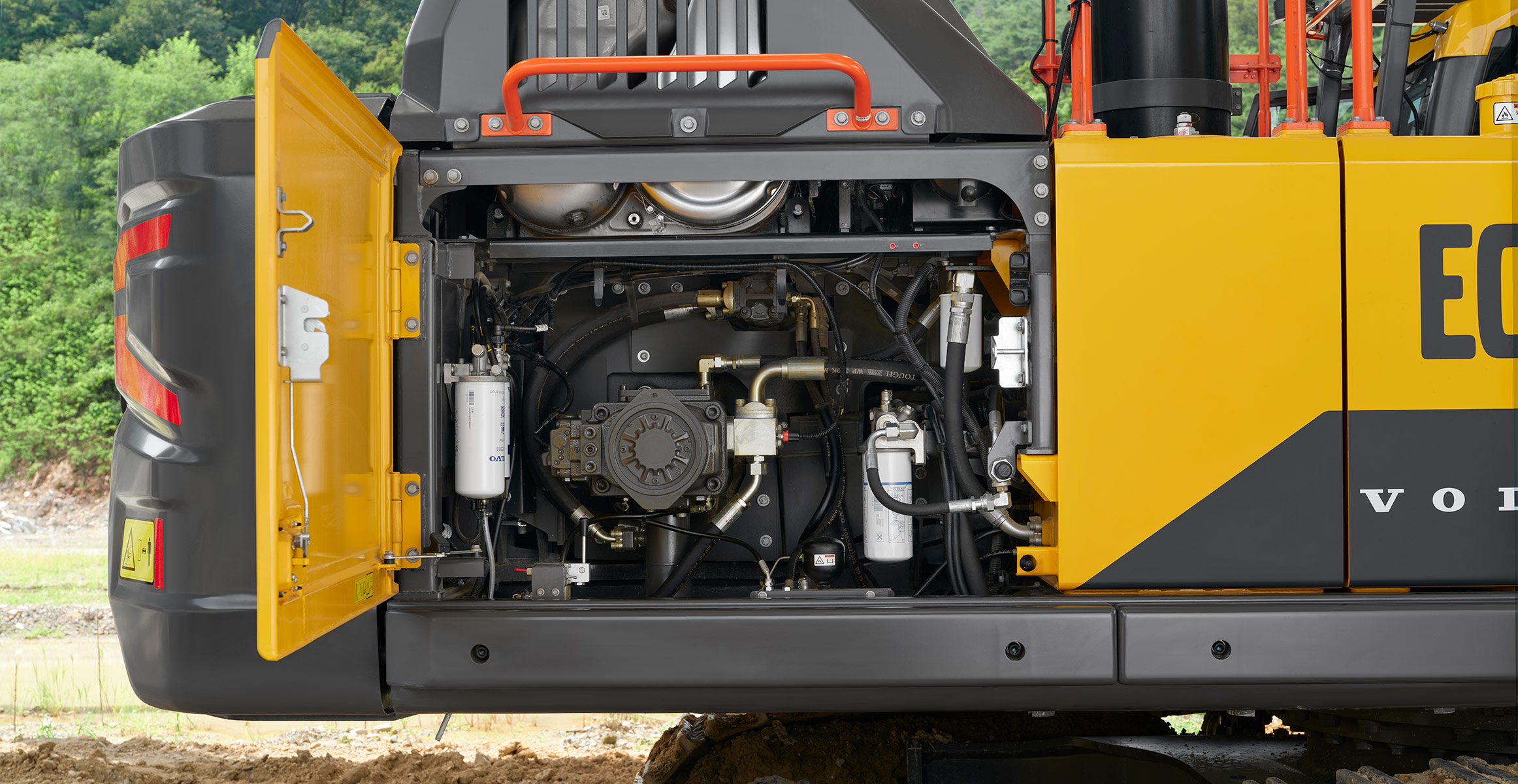 Close-up of the service compartment door open on a new Volvo excavator.