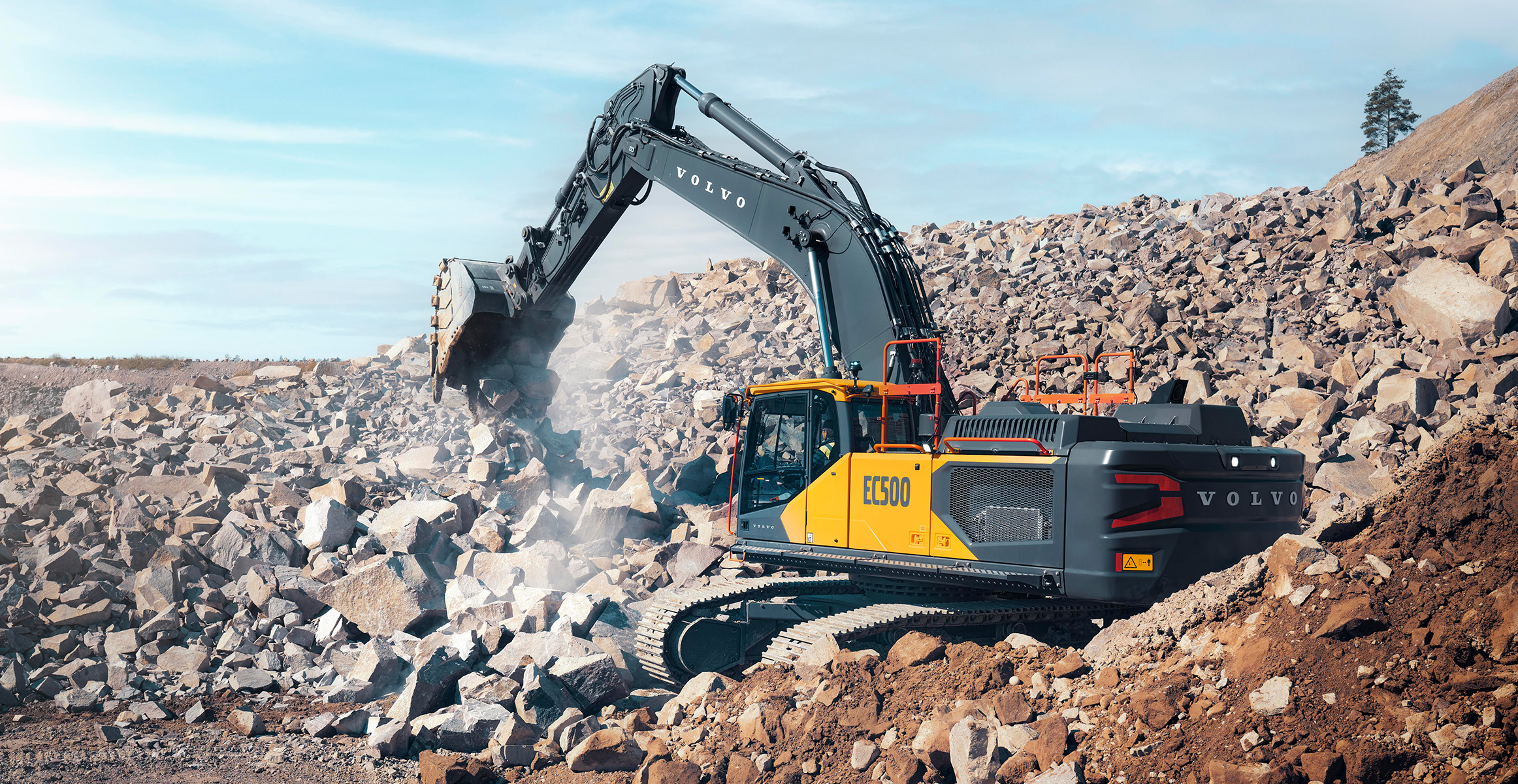 A Volvo EC500 excavator moving rock in a quarry.