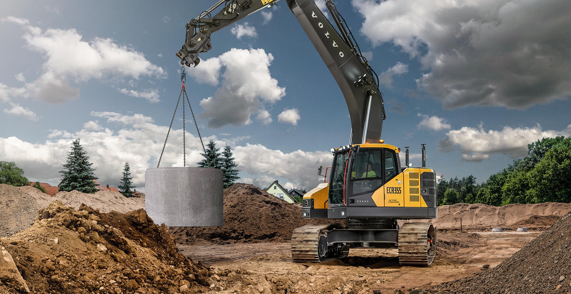 Volvo ECR355 excavator using Lift Assist Dig Assist machine control to safely move a concrete pipe. 