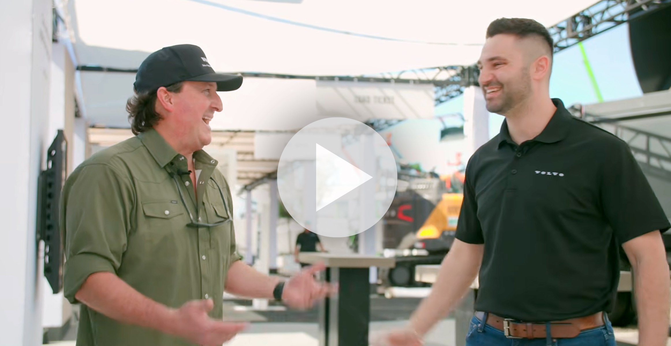 Screen grab of Mr. DiGG talking with a Volvo services rep at CONEXPO.