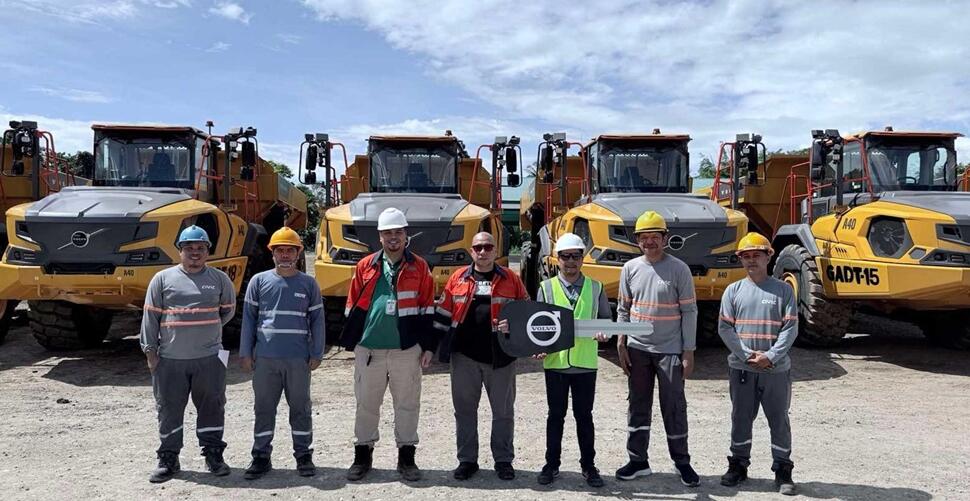 John Gerald Nofuente, the Greenstone Resources Corporation, and the Civic Merchandising team in front of the Eight New Generation A40 articulated haulers