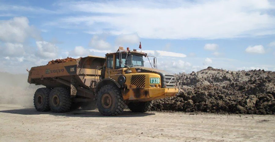 The Volvo articulated hauler is loaded with material.