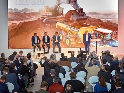 Bauma visitors listening to Volvo seminar.