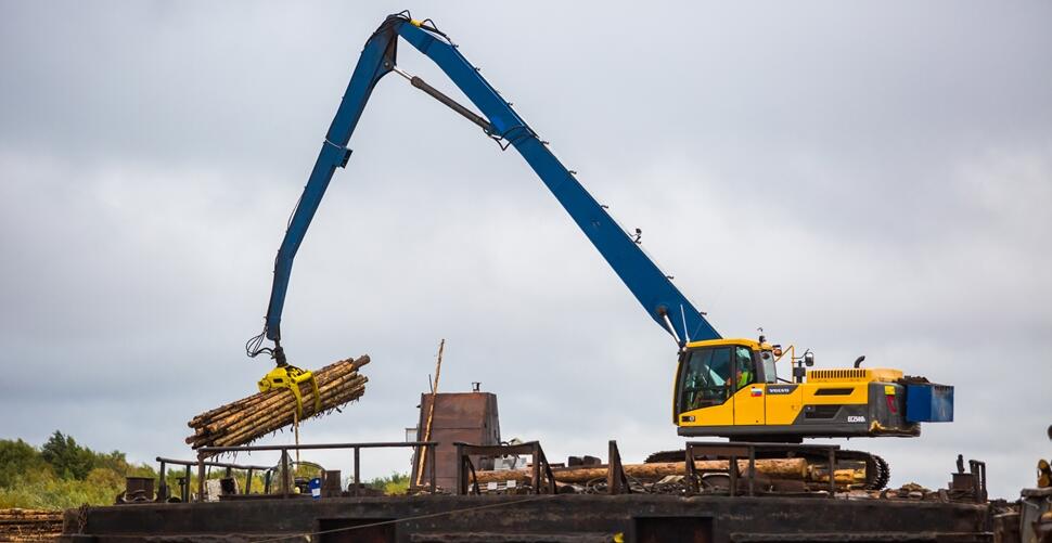 Modified Volvo EC250 excavator with grapple