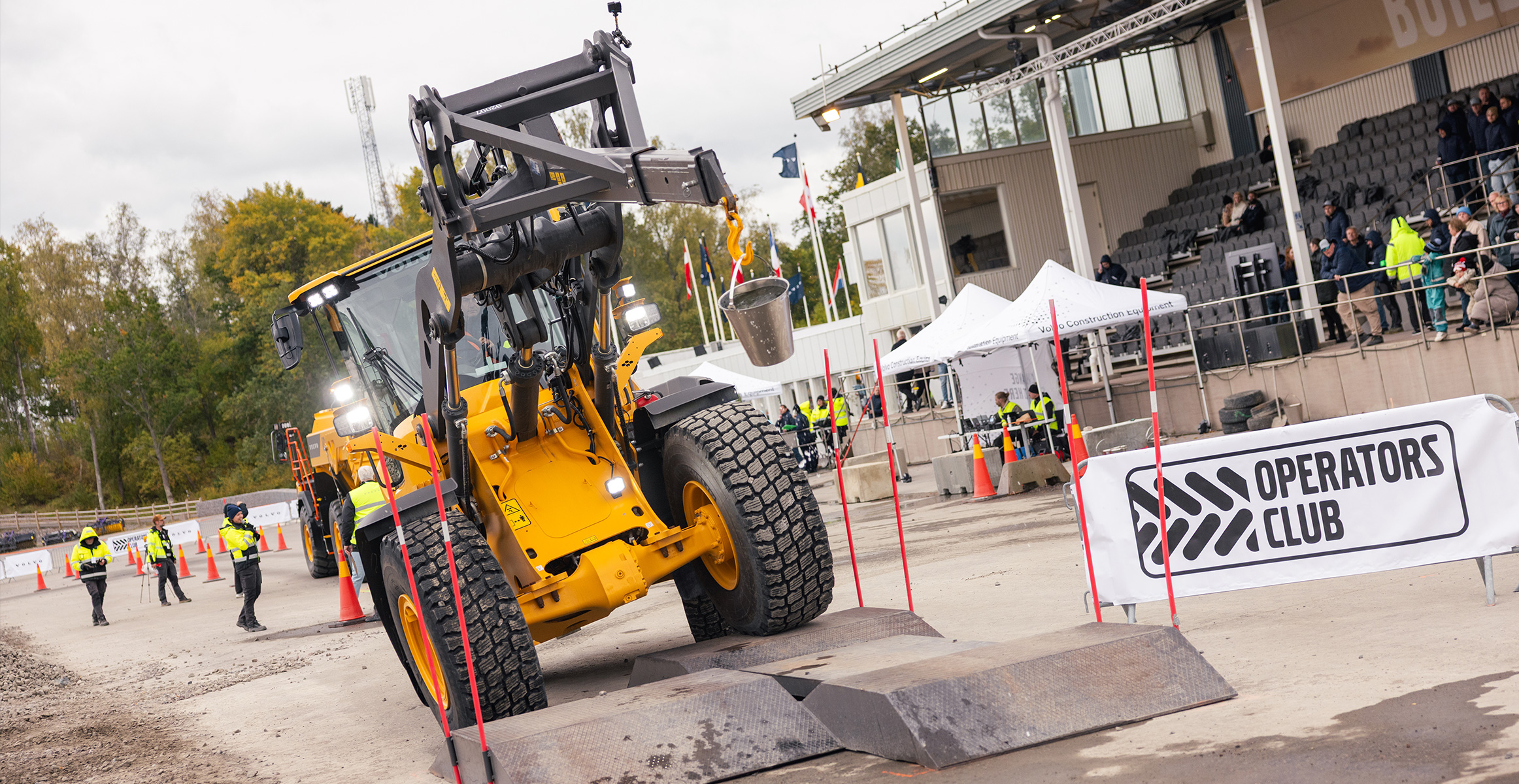 Wheel loader water bucket challenge during operators club final.
