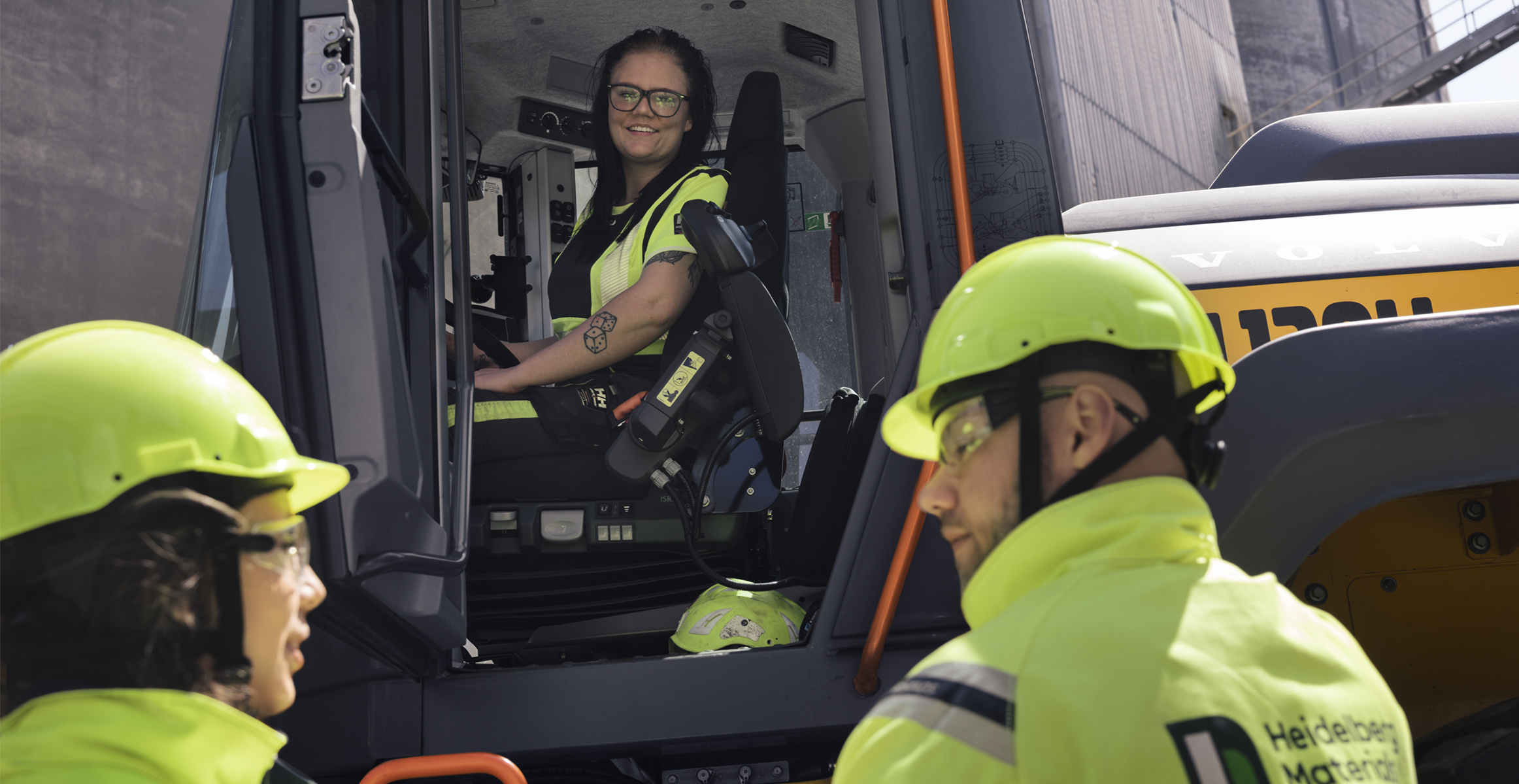 Machine operator in a rented electric construction machine.